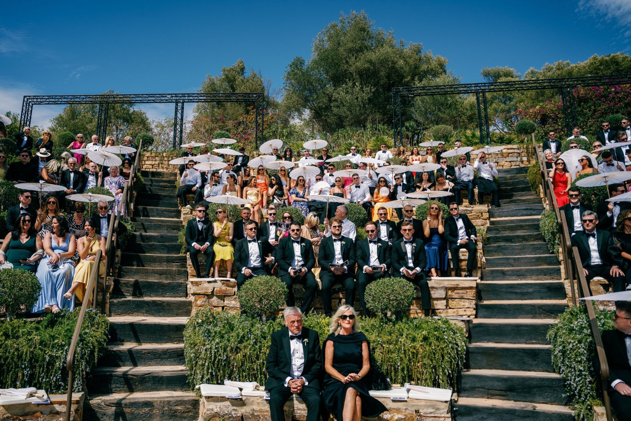 Guests seated on the terraced steps for the ceremony, wedding at Casa de la Era in Marbella