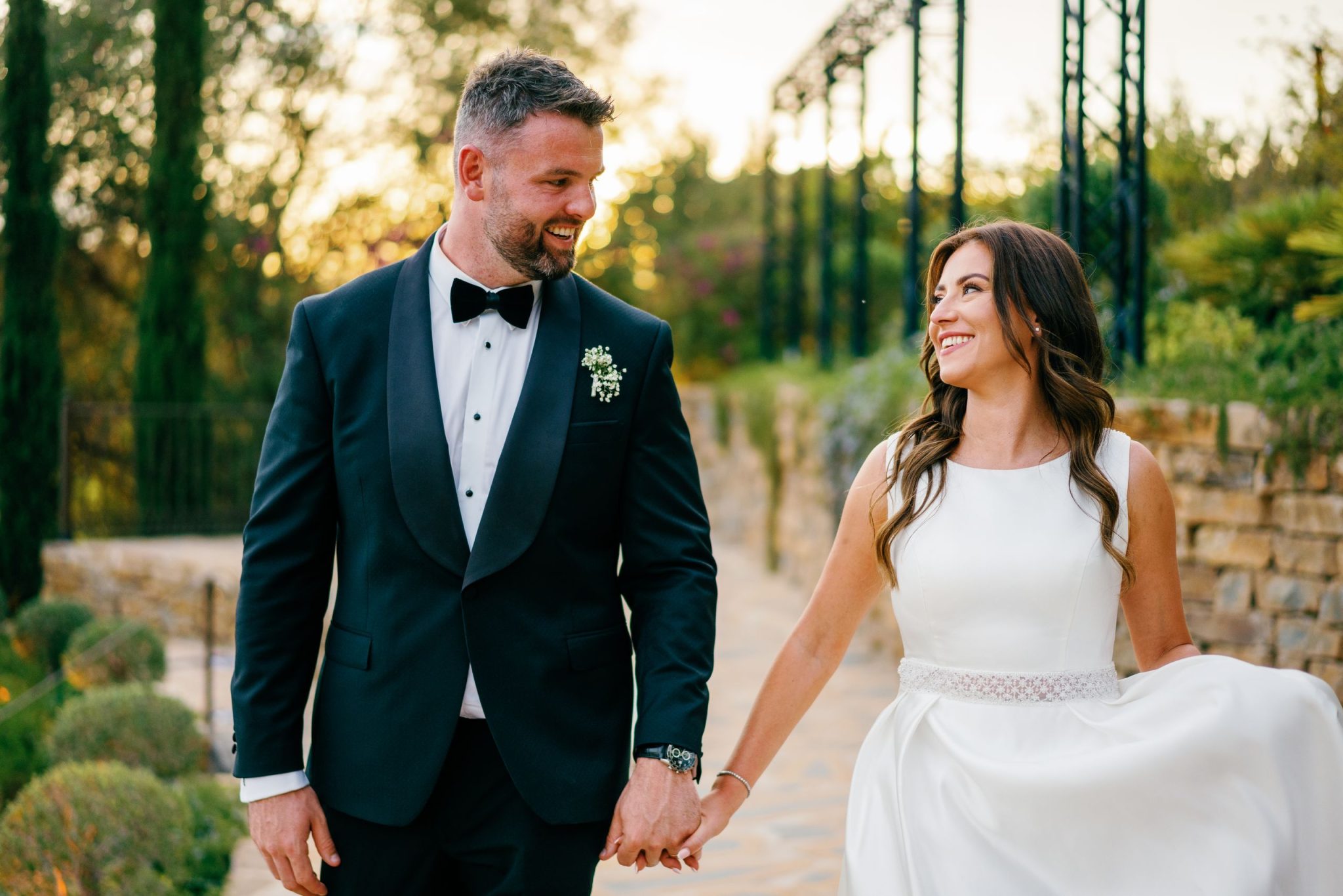 Couple holding hands at sunset, wedding at Casa de la Era in Marbella