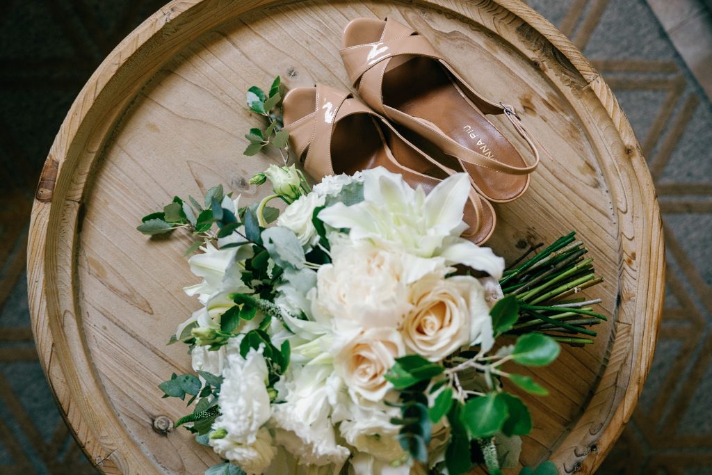 Bridal shoes and bouquet on a tray, Casa de la Era wedding in Marbella