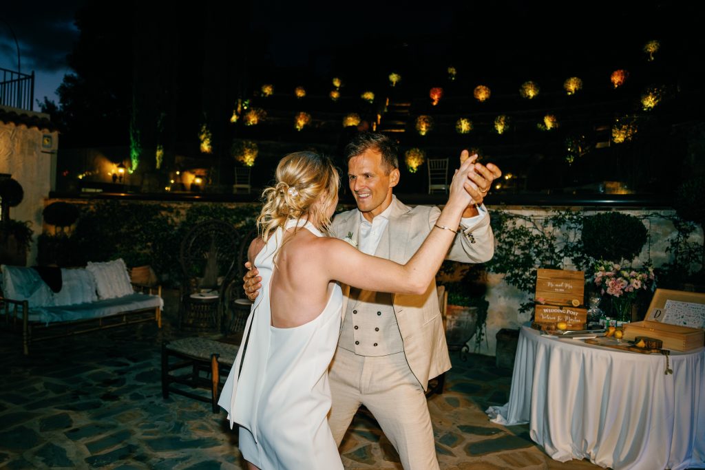 Couple dancing under the string lights, Casa de la Era wedding in Marbella