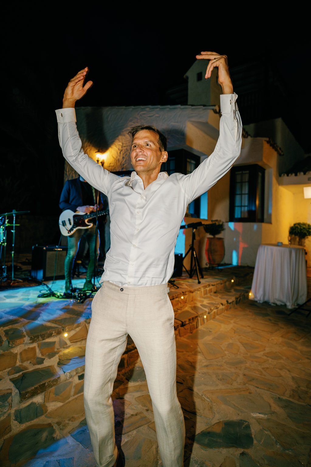 Groom dancing with his arms up, Casa de la Era wedding in Marbella