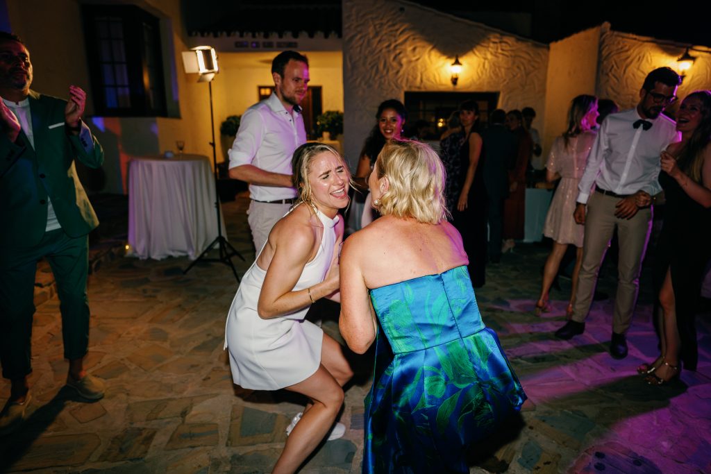 Bride dancing with a friend, Casa de la Era wedding in Marbella