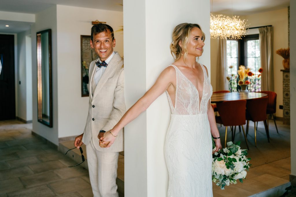 Vici and Martin holding hands before the first look, Casa de la Era wedding in Marbella