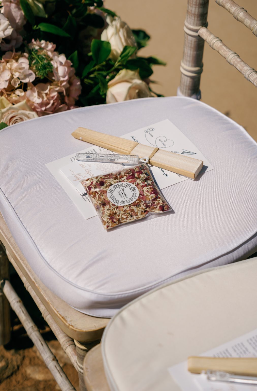 Order of service on a ceremony chair, Casa de la Era wedding in Marbella