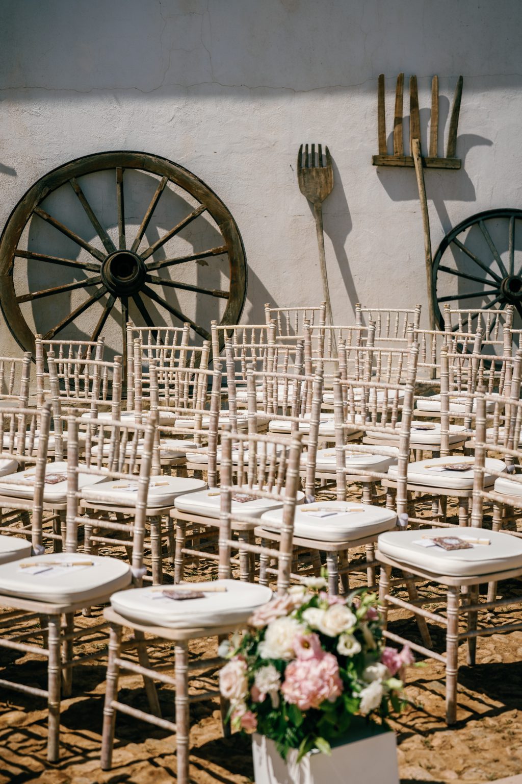 Ceremony chairs by the old farm wall, Casa de la Era wedding in Marbella