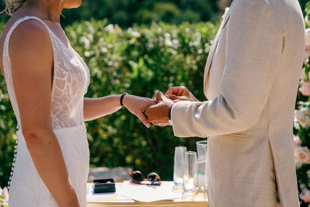 Groom placing the ring on the bride's finger, Casa de la Era wedding in Marbella