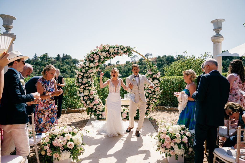 Newlyweds walking back down the aisle, Casa de la Era wedding in Marbella