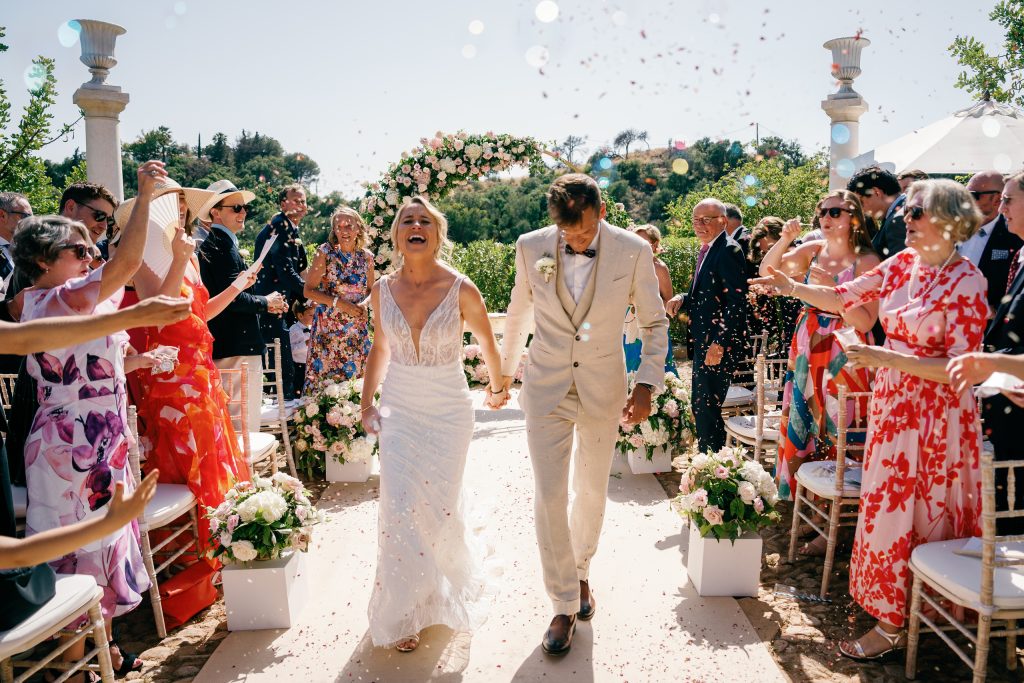 Guests throwing petals as the couple leave the ceremony, Casa de la Era wedding in Marbella