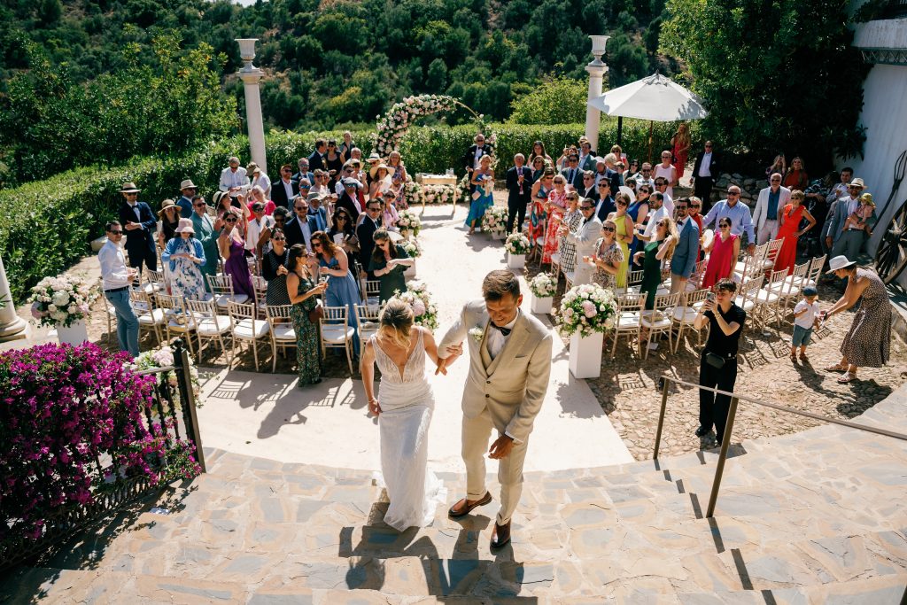 Couple walking among their guests after the ceremony, Casa de la Era wedding in Marbella