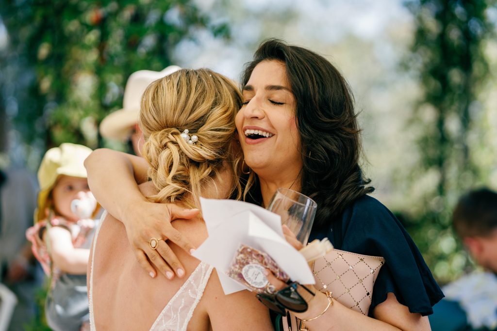 Bride hugging a friend after the ceremony, Casa de la Era wedding in Marbella