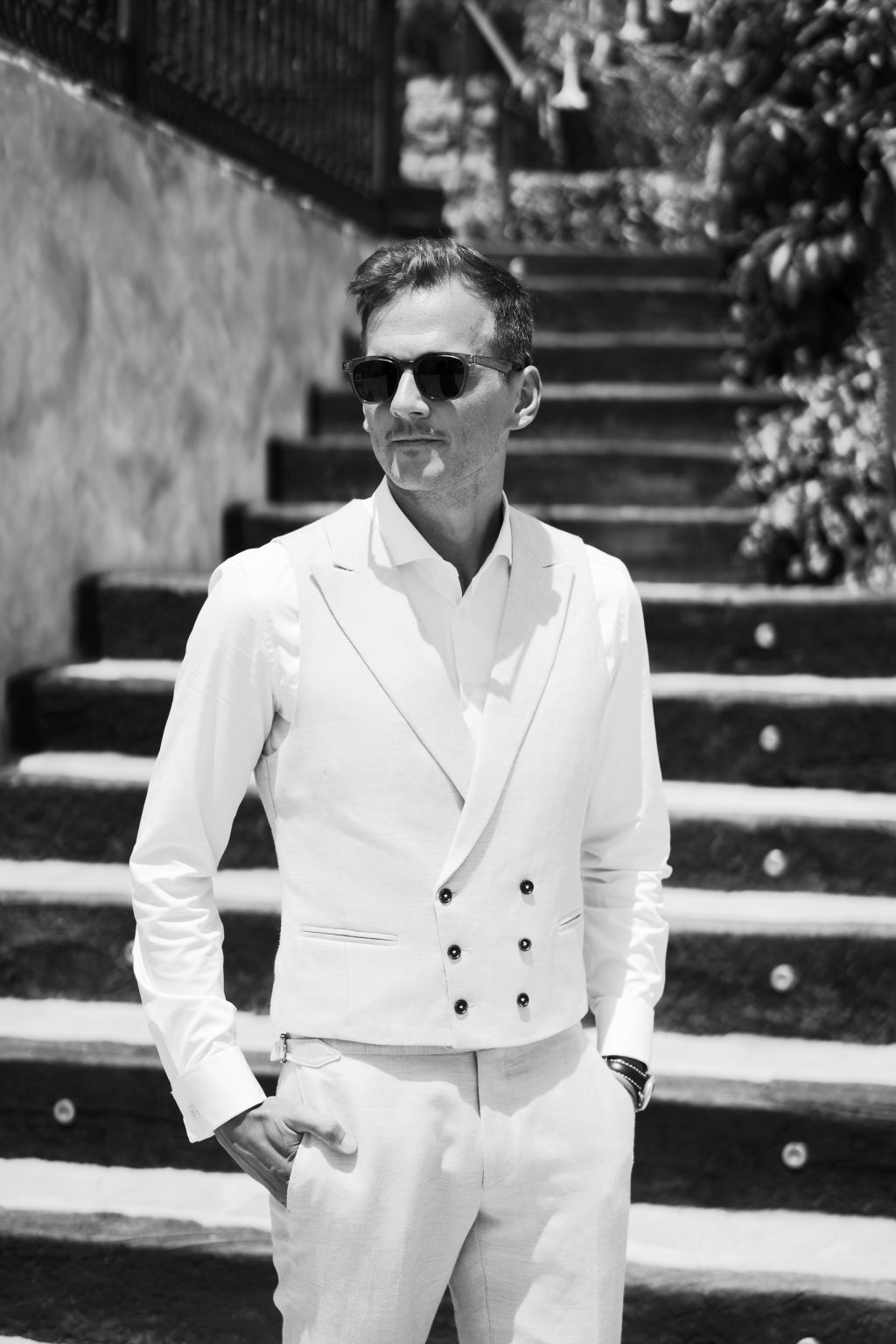 Black and white portrait of the groom on the stairs, Casa de la Era wedding in Marbella
