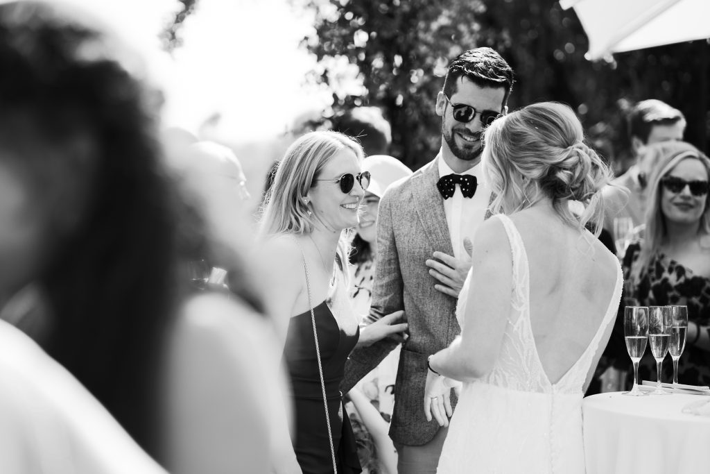 Black and white photo of guests at the cocktail, Casa de la Era wedding in Marbella