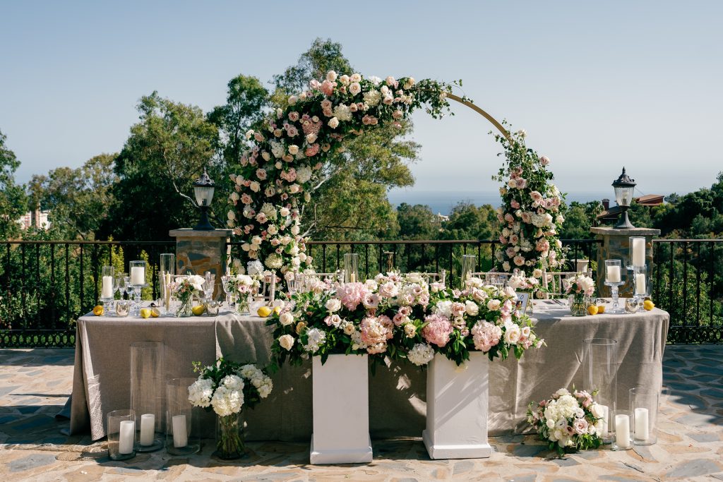 Head table with flowers and the hills behind, Casa de la Era wedding in Marbella