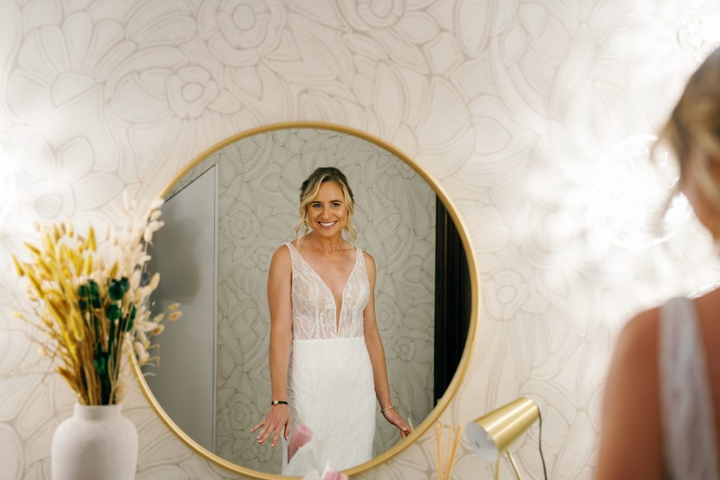 Bride looking at herself in a round mirror, Casa de la Era wedding in Marbella