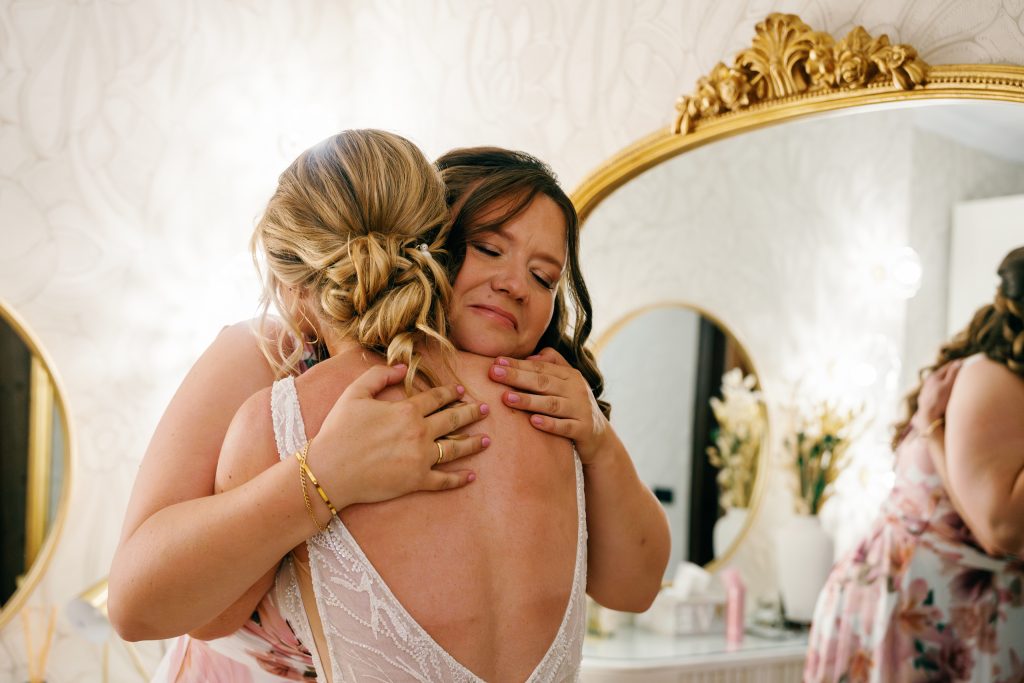 Bride hugging a friend while getting ready, Casa de la Era wedding in Marbella