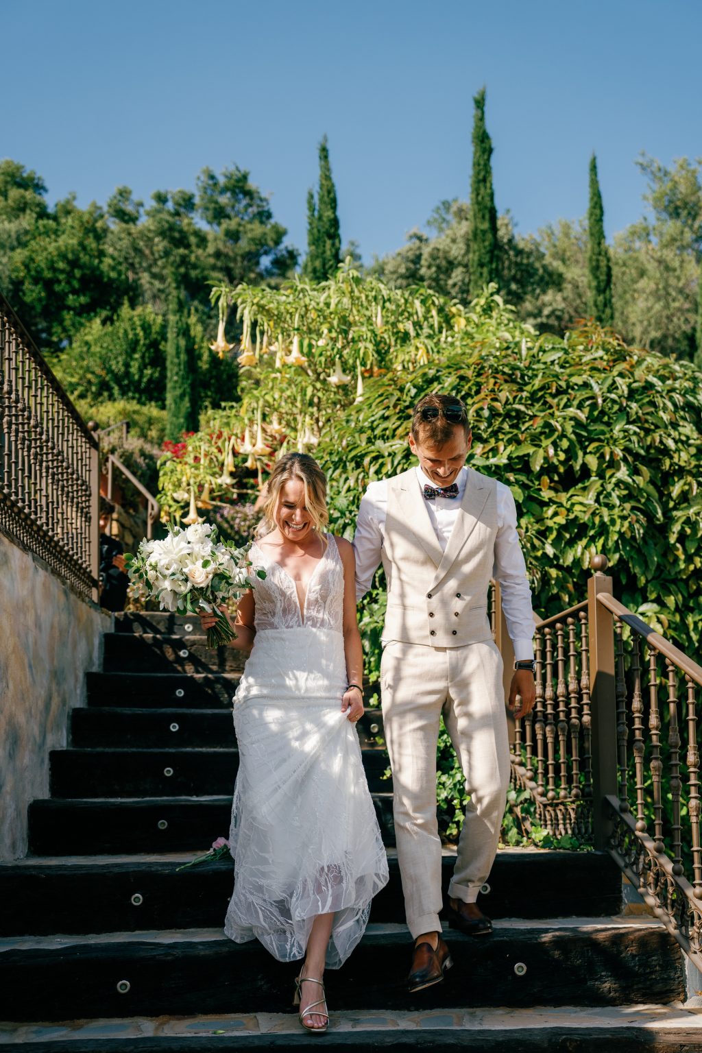 Vici and Martin walking down the stone steps, Casa de la Era wedding in Marbella