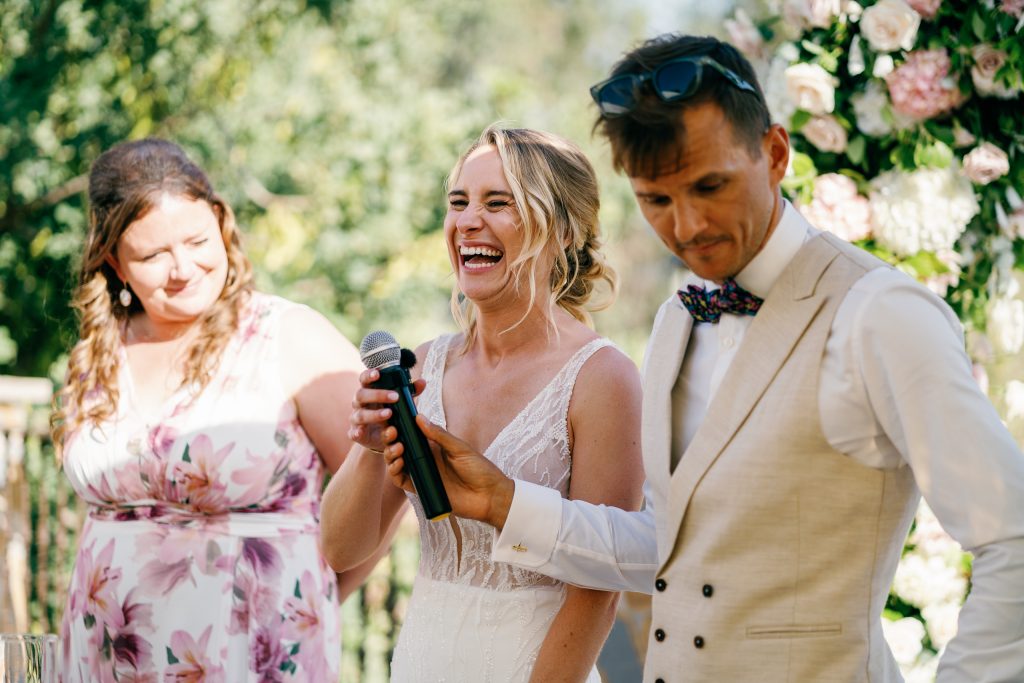 Couple laughing during their speech, Casa de la Era wedding in Marbella