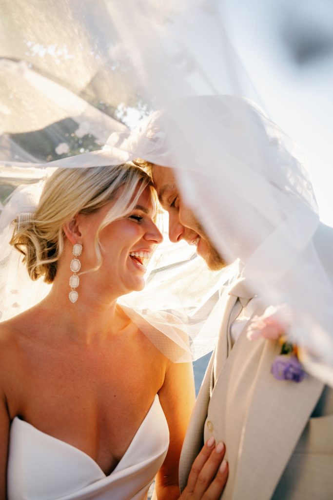 Bride and groom forehead to forehead under the veil, Cortijo Bravo wedding near Nerja