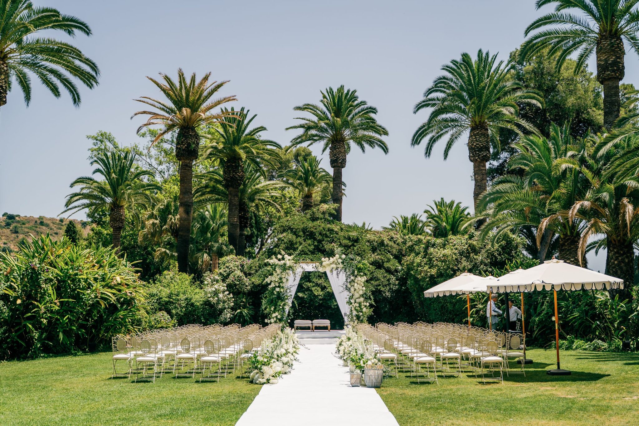 Ceremony set up among the palm trees, Finca La Concepción wedding in Marbella